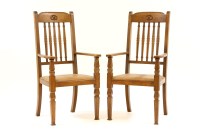 Lot 444 - A pair of early 20th century oak elbow chairs