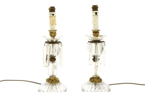 Lot 465 - A pair of 19th Century cut glass and gilt metal candlesticks
