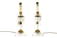 Lot 465 - A pair of 19th Century cut glass and gilt metal candlesticks