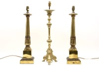 Lot 587 - A pair of brass column form lamps on stepped pedestal base