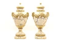 Lot 477 - A pair of faux marble and gilt heightened lidded urns