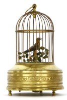 Lot 456 - An early 20th Century singing bird in a cage automaton