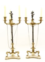 Lot 684 - A pair of Regency gilt metal and bronze three branch candelabra