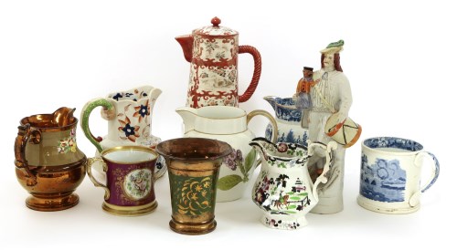 Lot 67 - A collection of Staffordshire pottery jugs and tankards