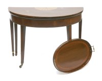 Lot 466 - A George III mahogany and fan inlaid foldover top tea table