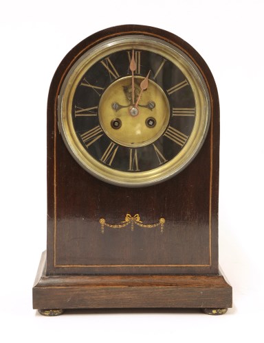 Lot 73 - An Edwardian strung mahogany mantel clock