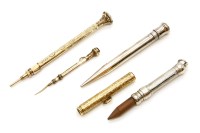 Lot 313 - Two gold telescopic action propelling pencils