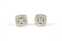 Lot 140 - A pair of 9ct white gold princess cut and brilliant cut diamond halo cluster earrings