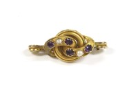 Lot 148 - A Victorian amethyst and split pearl twisted knot brooch