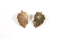 Lot 119 - A pair of single stone diamond leaf shaped earrings