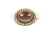 Lot 194 - A Victorian pink foiled quartz cabochon and split pearl brooch