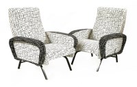Lot 335 - A pair of upholstered reclining armchairs