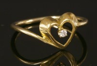 Lot 122 - A gold single stone diamond 'Loving Heart' ring by Tiffany