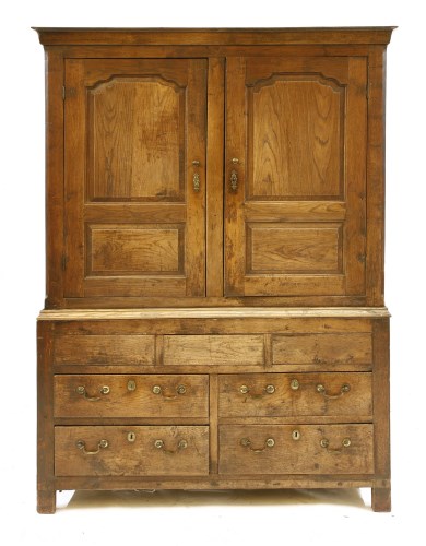 Lot 515 - A George III oak press cupboard