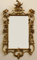 Lot 520 - A Rococo style gilt framed wall mirror