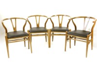 Lot 352 - Four Hans Wegner Wishbone style chairs