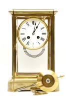 Lot 618 - A 19th century four glass brass mantel clock