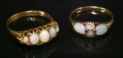 Lot 109 - A late Victorian opal and ruby boat-shaped ring