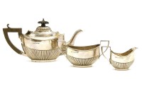 Lot 395 - An Edwardian three piece miniature silver tea set
