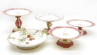 Lot 641 - A set of three Minton style porcelain comports with pink borders