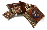 Lot 522A - Three large carpet cushions and two smaller