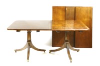 Lot 425 - A two pillar dining table