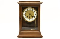 Lot 716 - A Victorian mantle clock in a walnut case