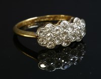 Lot 151 - A diamond set triple daisy cluster ring