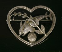 Lot 267 - A sterling silver heart shaped dolphin brooch by Georg Jensen designed by Arno Molinowski