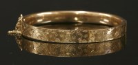 Lot 645 - A 9ct gold hinged bangle, by Cropp & Farr