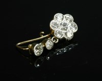 Lot 152 - A single stone diamond set daisy cluster drop earring