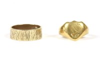 Lot 74 - A ladies 18ct gold shield shaped signet ring