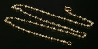 Lot 159 - An Edwardian seed pearl gold chain