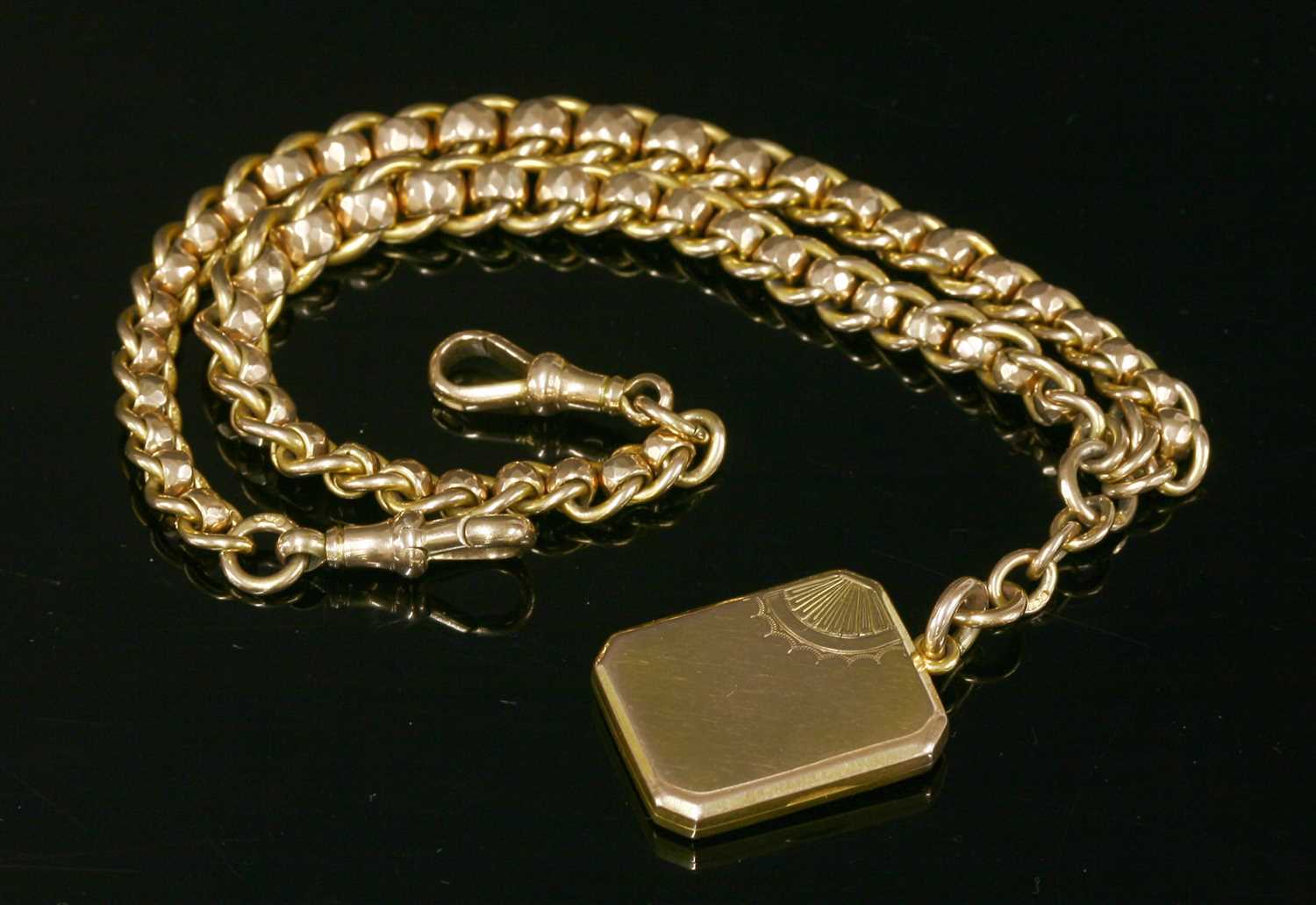 Lot 585 - A 9ct gold late Victorian, curb and faceted belcher, double albert chain