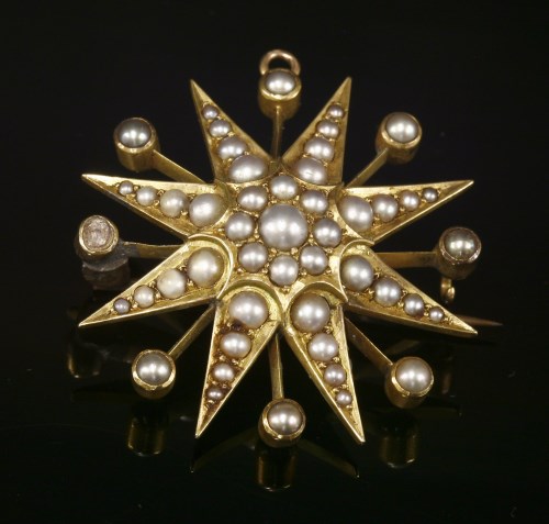 Lot 85 - A late Victorian gold and split pearl star burst brooch
