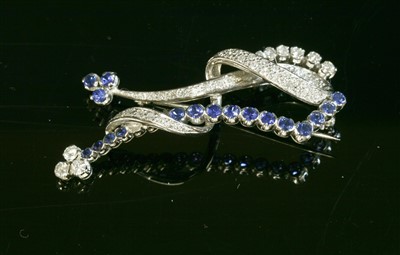 Lot 307 - An 18ct white gold sapphire and diamond brooch