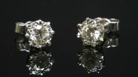 Lot 468 - A pair of white gold, single stone diamond stud earrings