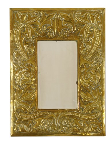 Lot 52 - An Arts and Crafts brass wall mirror