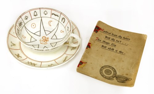 Lot 382 - A FORTUNE TELLER'S TEACUP AND SAUCER