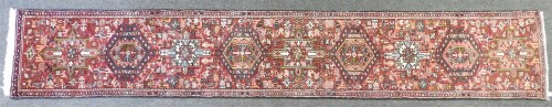 Lot 464 - A hand knotted Persian runner retailed by Liberty