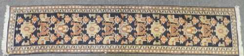 Lot 531 - A hand knotted Caucasian runner retailed by Liberty