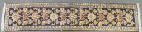 Lot 531A - A hand knotted Caucasian runner retailed by Liberty
