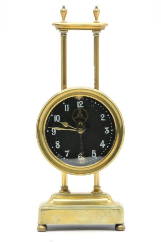 Lot 154 - A brass 'Gravity' mantel clock