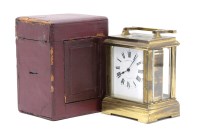 Lot 141 - A brass carriage clock