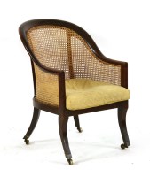 Lot 461 - A 19th century mahogany tub form library chair
