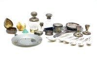 Lot 124 - A collection of silver items to include two silver topped perfume jars and a heart shaped trinket box
