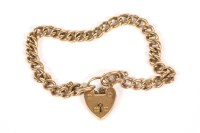 Lot 51 - A 9ct gold curb link bracelet with padlock