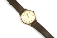 Lot 91 - A gentlemen's gold Smiths Astral mechanical strap watch