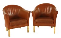 Lot 733 - A pair of Danish tan leather armchairs