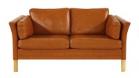 Lot 691 - A Danish two-seater tan leather settee